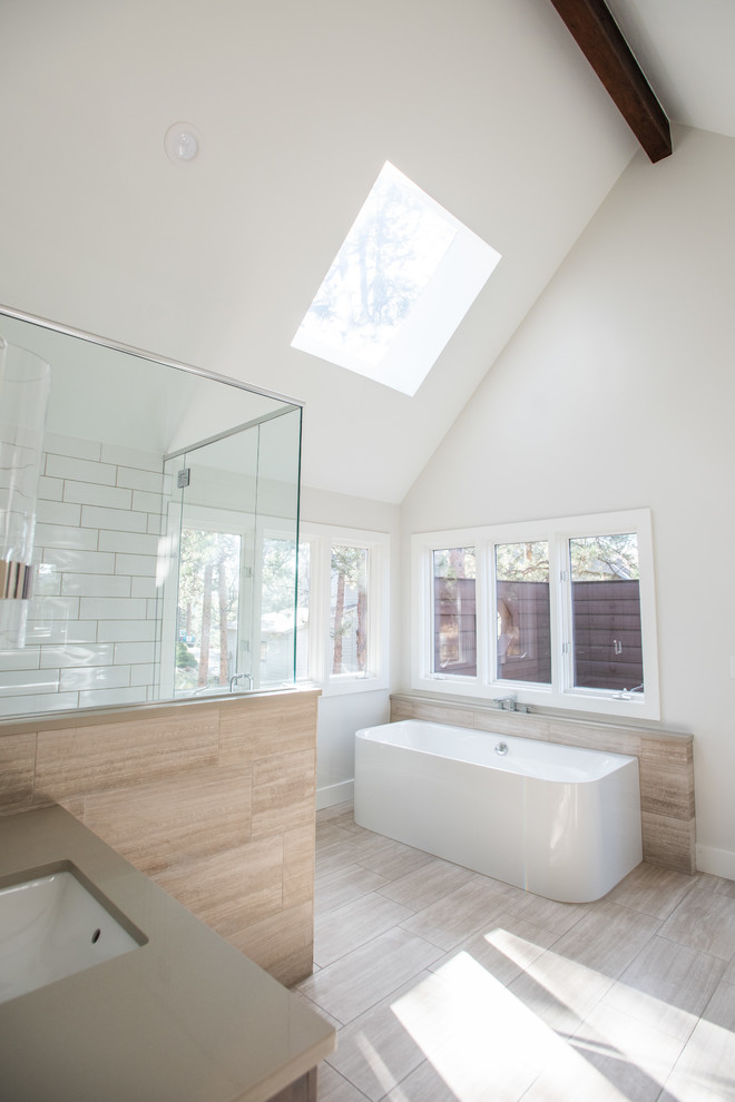 Design ideas for a mid-sized contemporary master wet room bathroom in Denver with shaker cabinets, dark wood cabinets, a drop-in tub, white tile, mosaic tile, beige walls, medium hardwood floors, an undermount sink, granite benchtops and a hinged shower door.