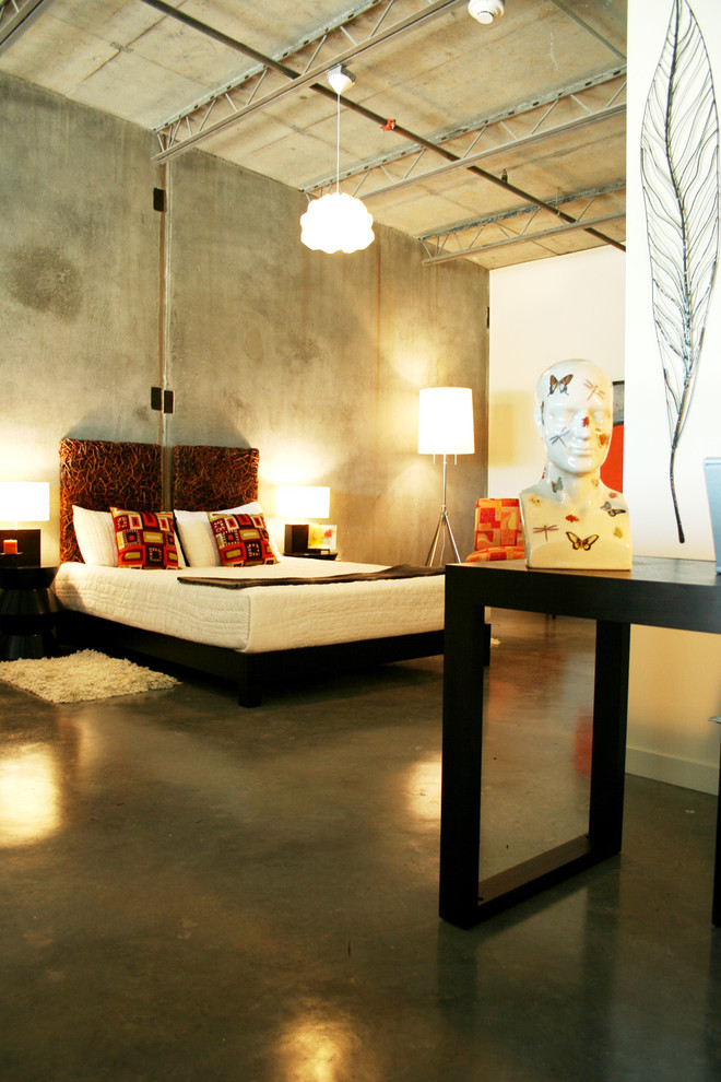 Design ideas for an industrial bedroom in Portland with concrete floors and grey floor.