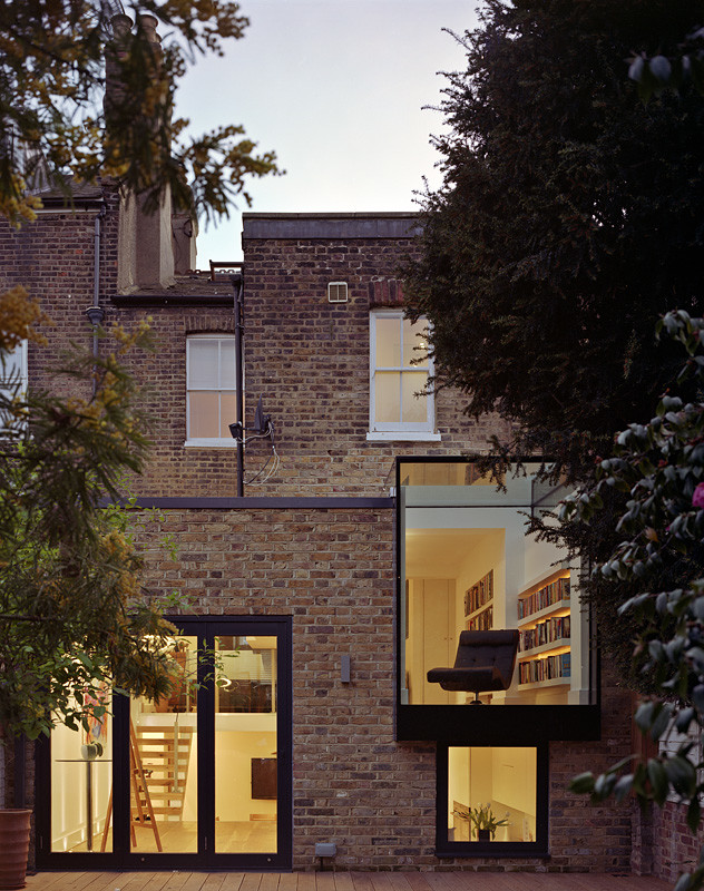 This is an example of a mid-sized contemporary one-storey glass exterior in London.