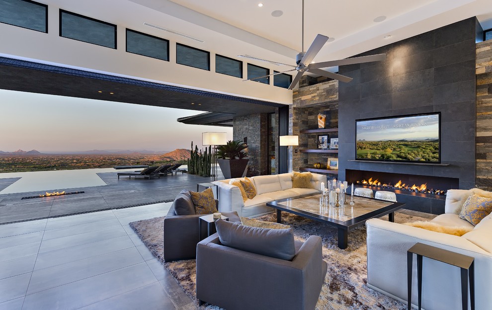 Photo of a large modern open concept living room in Phoenix with white walls, porcelain floors, a ribbon fireplace, a stone fireplace surround and a wall-mounted tv.