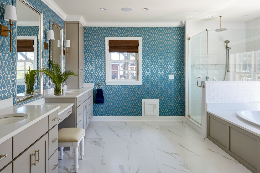 This is an example of a large beach style master bathroom in Jacksonville with shaker cabinets, grey cabinets, a drop-in tub, a corner shower, white tile, blue walls, porcelain floors, an undermount sink, engineered quartz benchtops, white floor, a hinged shower door and subway tile.