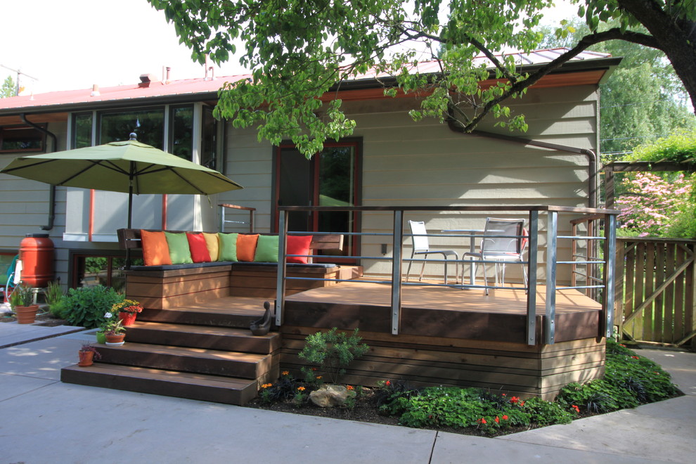 Small eclectic backyard deck photo in Seattle with no cover