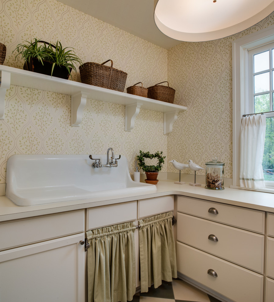 Inspiration for a traditional laundry room in Detroit with beige cabinets, an utility sink and beige benchtop.
