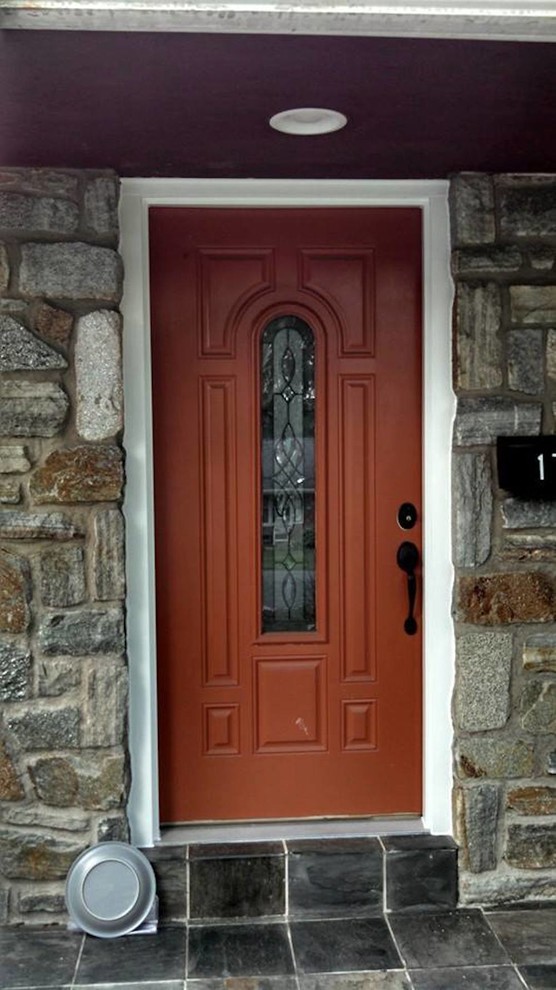 Front door - small transitional front door idea with a red front door