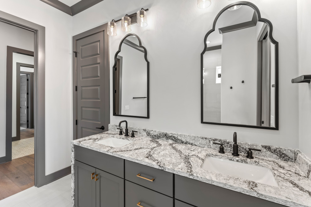Bathroom - mid-sized transitional master white floor and double-sink bathroom idea with recessed-panel cabinets, gray cabinets, an undermount sink, gray countertops and a built-in vanity