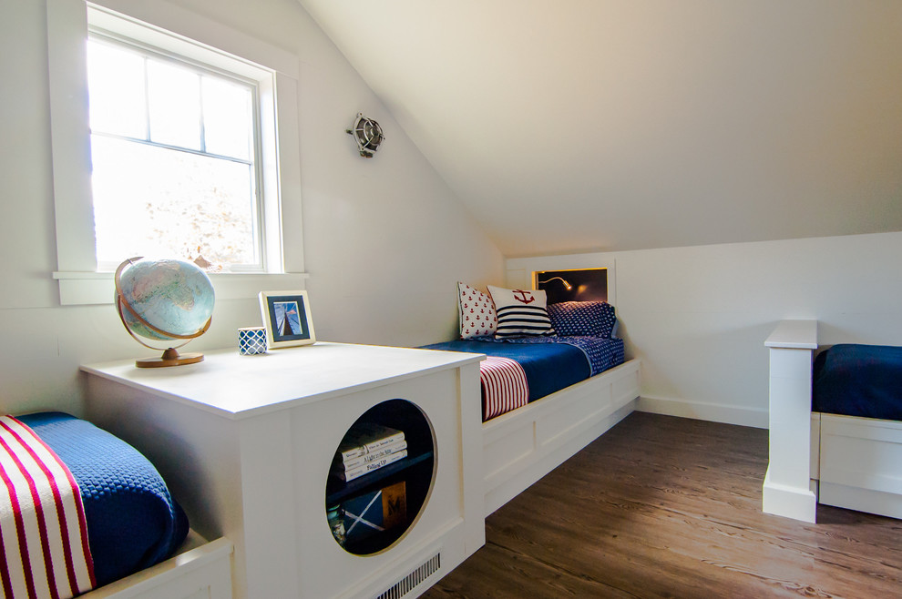 Mid-sized traditional gender-neutral kids' room in Portland Maine with white walls and medium hardwood floors.
