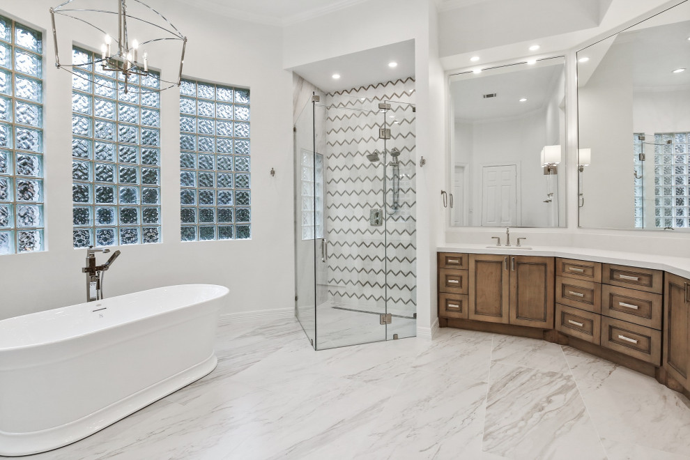This is an example of a large transitional master bathroom in Houston with recessed-panel cabinets, beige cabinets, a freestanding tub, a curbless shower, a two-piece toilet, white tile, marble, white walls, ceramic floors, an undermount sink, engineered quartz benchtops, white floor, a hinged shower door, white benchtops, a niche, a double vanity and a built-in vanity.