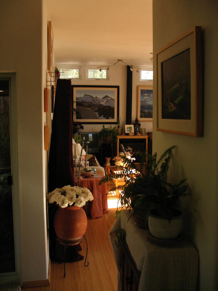 This is an example of an eclectic open concept family room in Albuquerque.