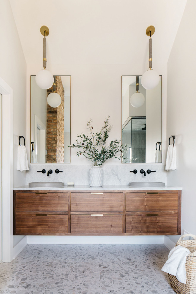 Midcentury master bathroom in Chicago with flat-panel cabinets, medium wood cabinets, beige walls, a vessel sink, multi-coloured floor, grey benchtops, a double vanity, a floating vanity and vaulted.