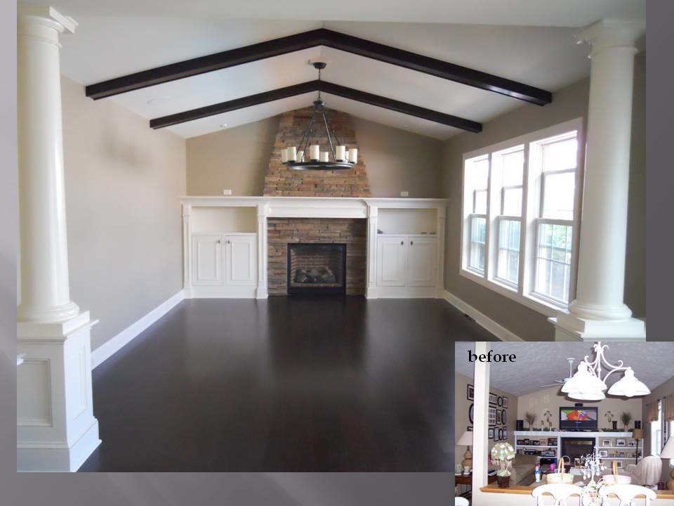 This is an example of a mid-sized traditional kitchen/dining combo in New York with beige walls, bamboo floors, a standard fireplace and a stone fireplace surround.