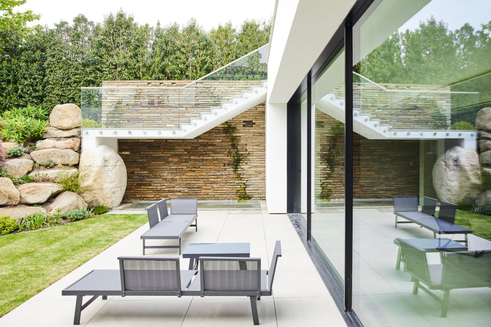 Inspiration for a large contemporary patio remodel in London