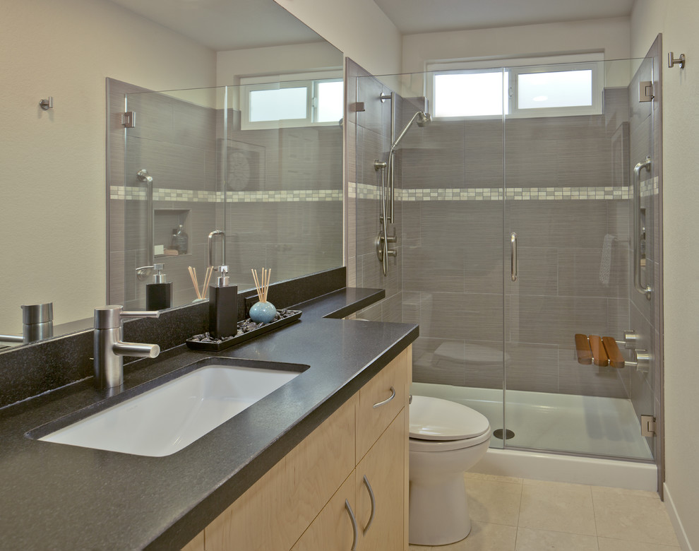 Inspiration for a contemporary bathroom in San Francisco with flat-panel cabinets, light wood cabinets and brown tile.