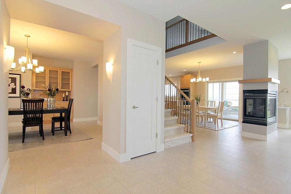 Enclosed dining room - mid-sized transitional ceramic tile enclosed dining room idea with beige walls