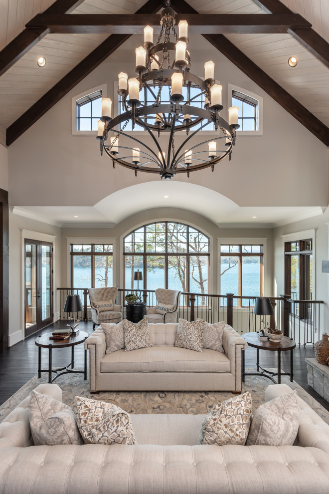 Inspiration for a large country formal living room in Other with a standard fireplace, a stone fireplace surround and vaulted.
