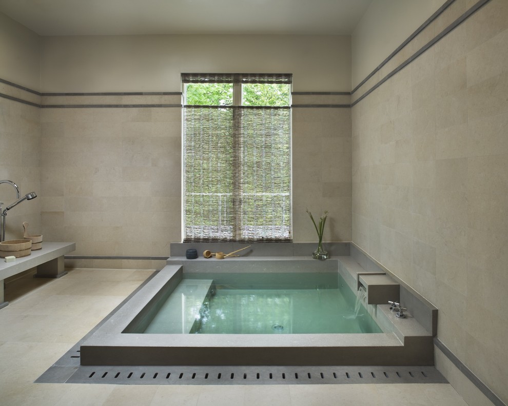 Inspiration for a contemporary bathroom in New York with a japanese tub.