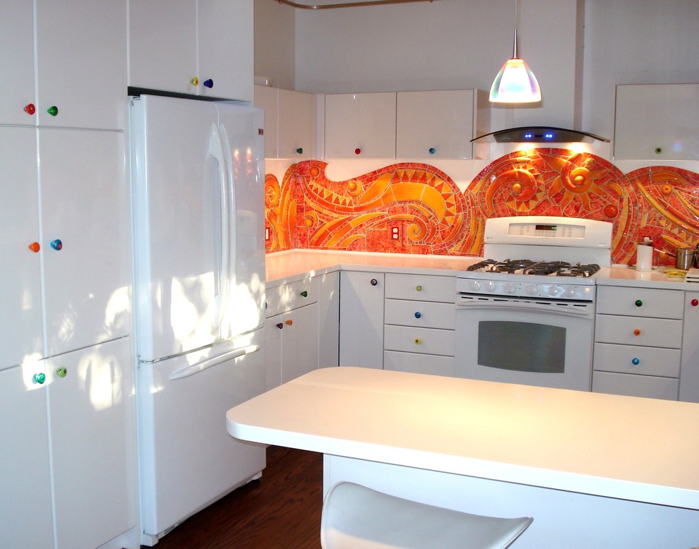 Inspiration for an eclectic u-shaped kitchen with orange splashback, white appliances, flat-panel cabinets and white cabinets.