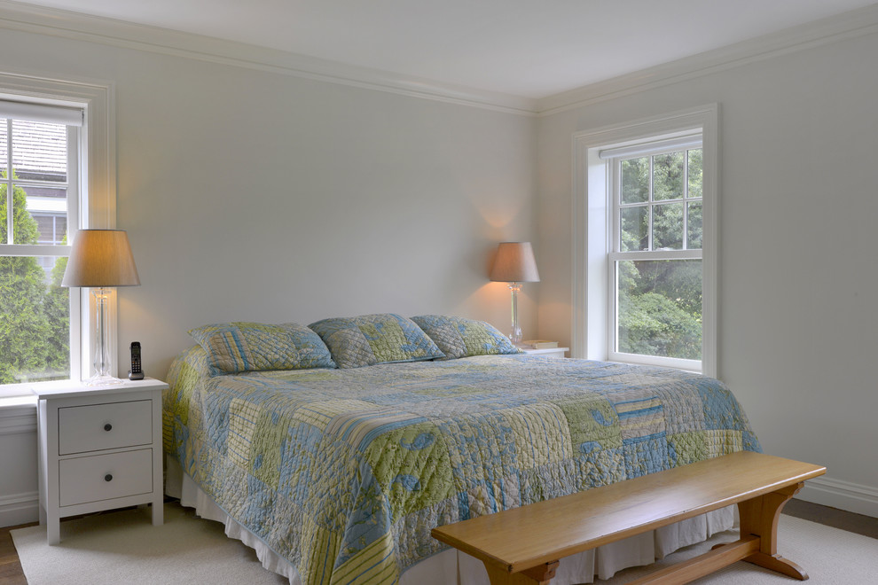 Elegant master bedroom photo in New York with gray walls