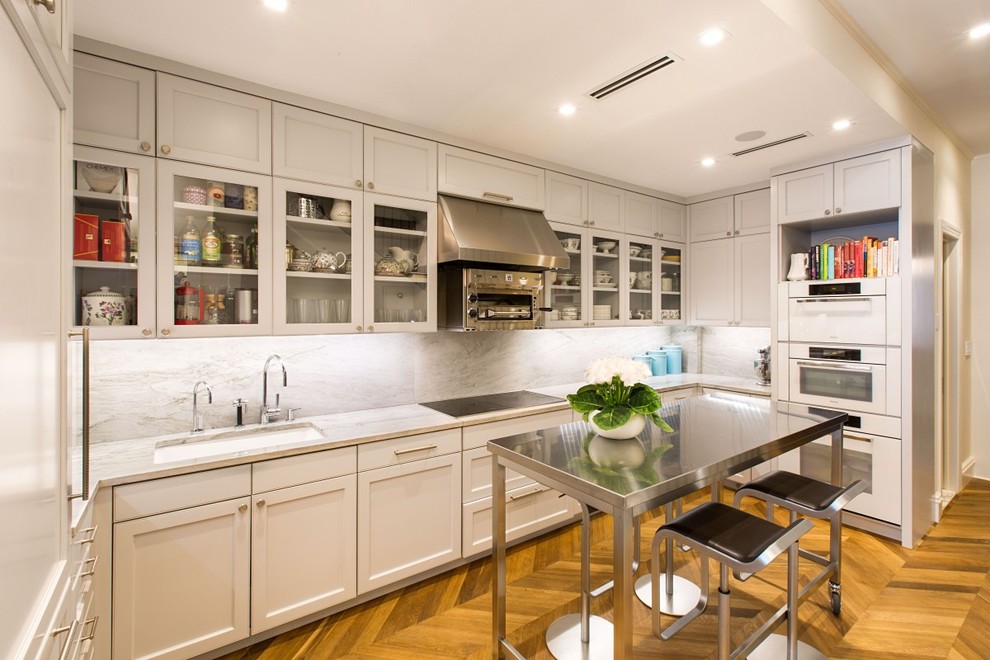 Example of a transitional medium tone wood floor kitchen design in New York