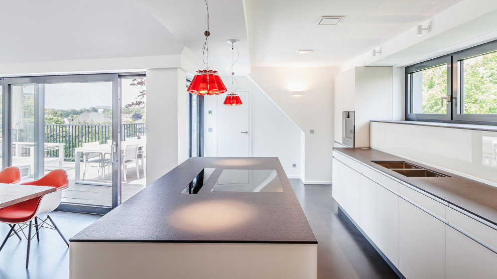 Inspiration for a large modern kitchen in Melbourne with beaded inset cabinets, white cabinets, soapstone benchtops, ceramic floors, beige floor and wallpaper.