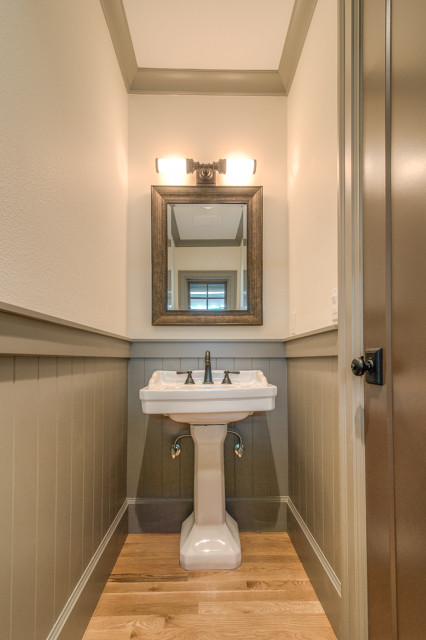 This is an example of a mediterranean powder room in Portland.