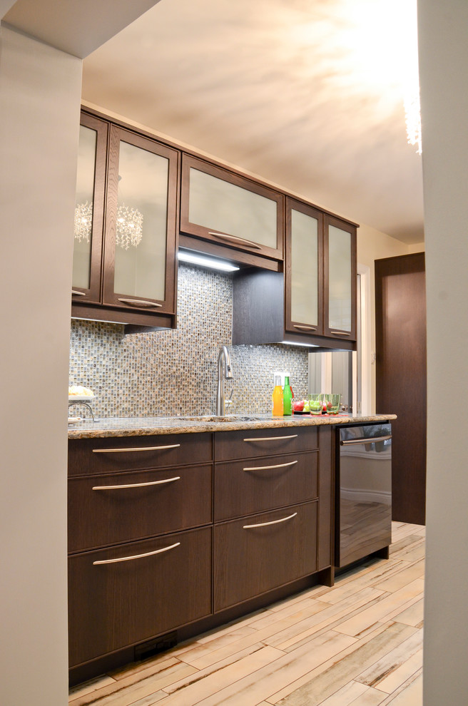Kitchen - mid-sized transitional galley porcelain tile kitchen idea in Ottawa with an undermount sink, glass-front cabinets, brown cabinets, quartz countertops, brown backsplash, glass sheet backsplash and stainless steel appliances