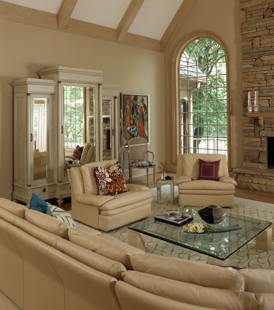 This is an example of a mid-sized transitional formal open concept living room in Atlanta with light hardwood floors and beige walls.