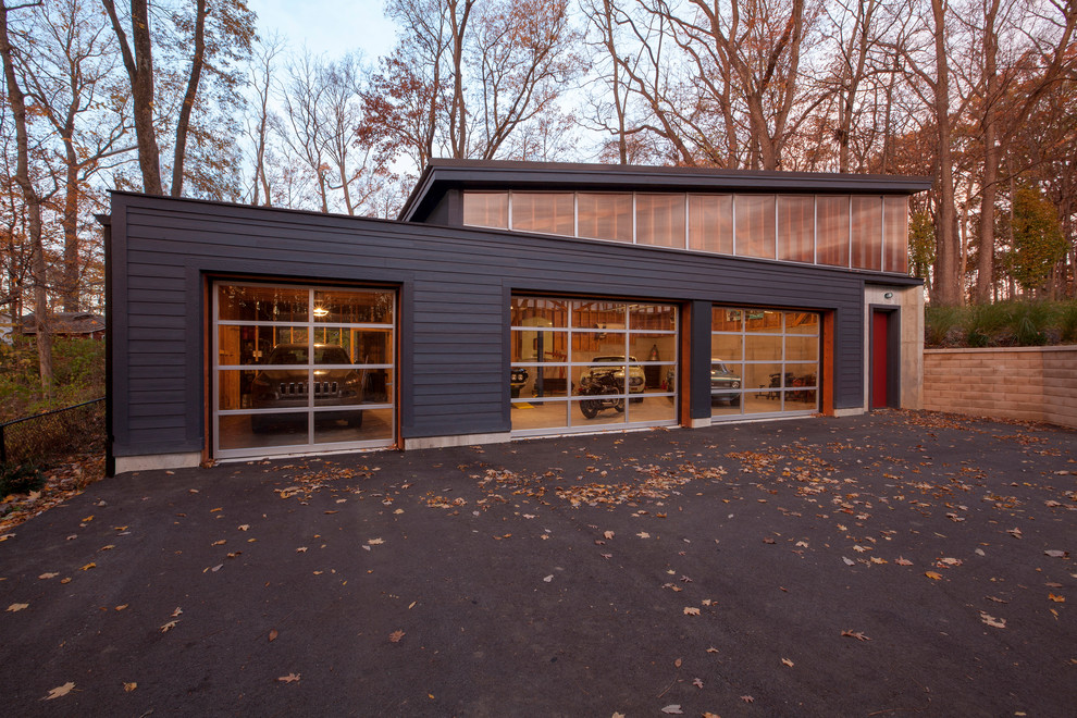 Inspiration for a large midcentury detached four-car workshop in Indianapolis.