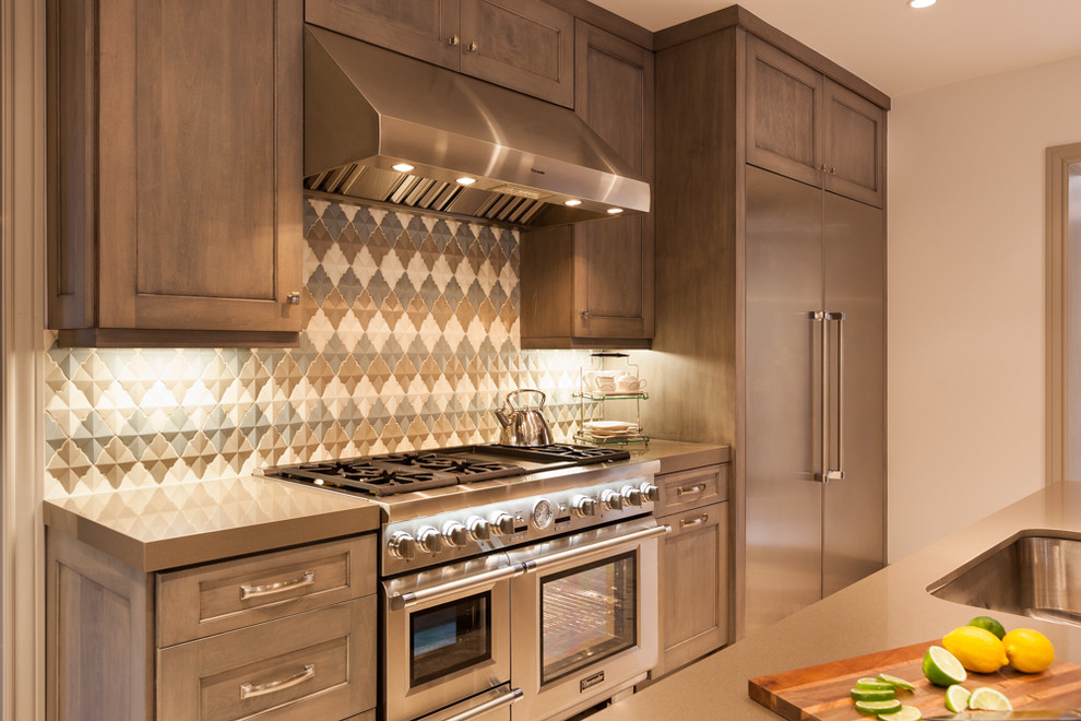 Example of a large transitional eat-in kitchen design in Houston with recessed-panel cabinets, light wood cabinets, granite countertops, multicolored backsplash, stainless steel appliances and an island