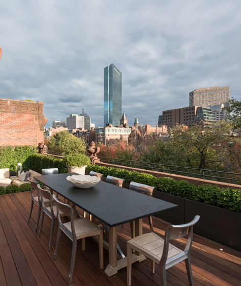 Inspiration for an expansive transitional rooftop deck in Boston with an outdoor kitchen and no cover.