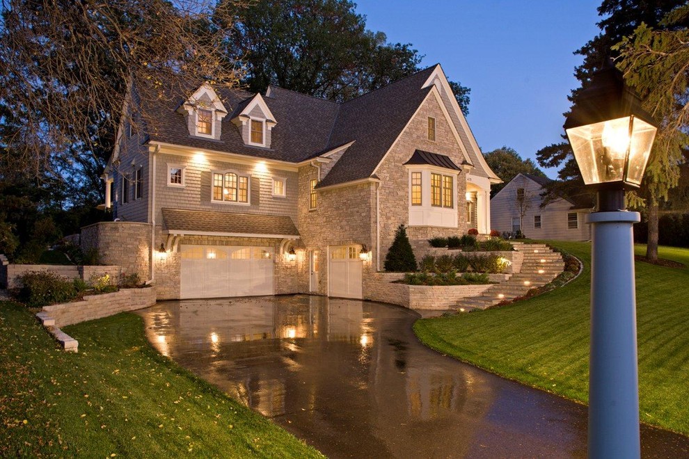 Inspiration for a traditional exterior in Minneapolis with stone veneer.