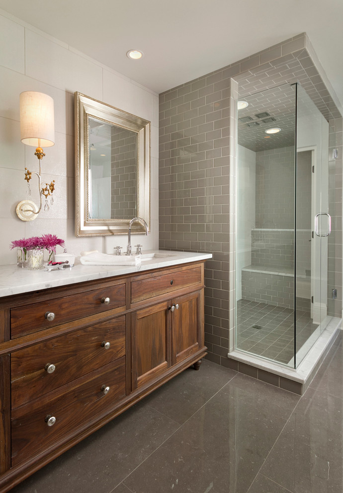 Design ideas for a transitional bathroom in Minneapolis with dark wood cabinets and grey floor.