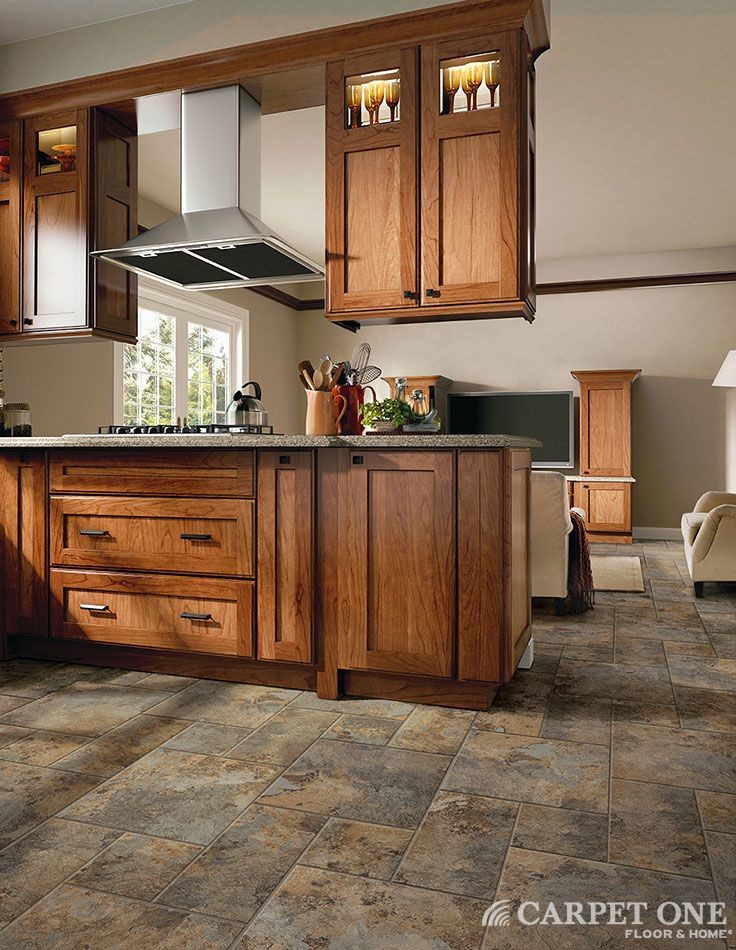 Design ideas for a mid-sized country kitchen in Chicago with shaker cabinets, medium wood cabinets, granite benchtops and vinyl floors.