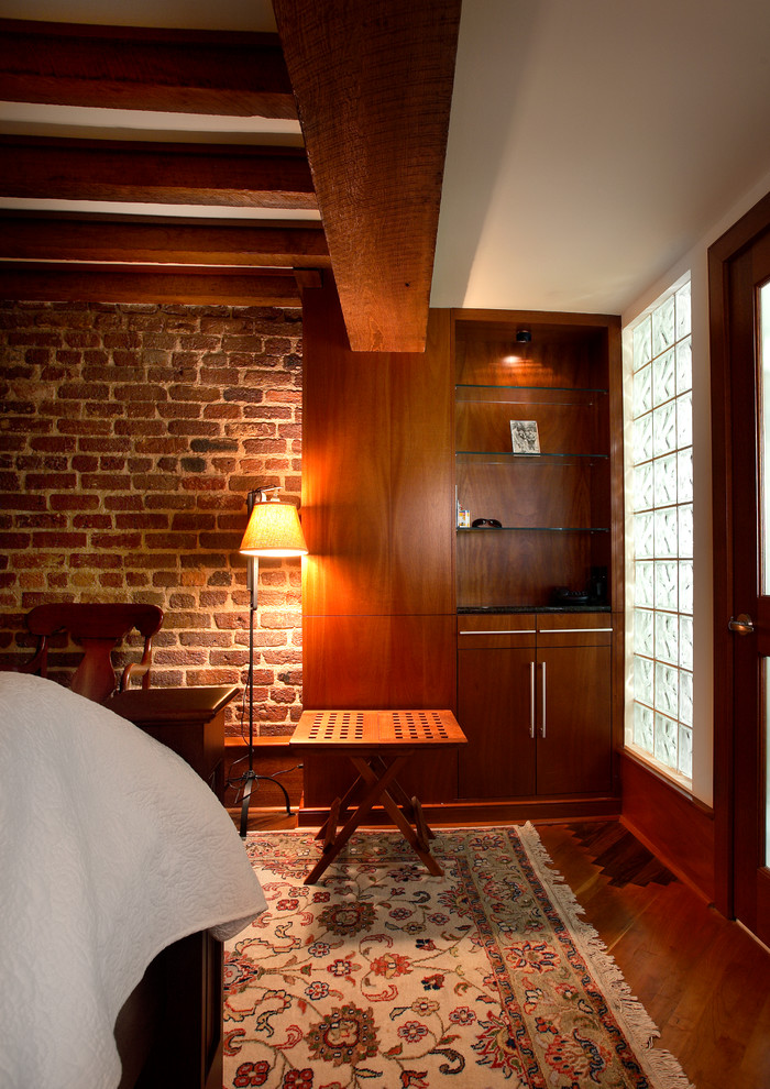 Beams, Restored Brick, and Casework detail the Loft Bedroom, with a radiant wall