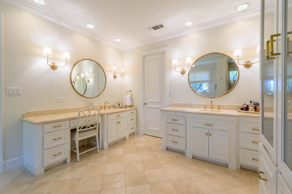 This is an example of a large traditional master wet room bathroom in Dallas with flat-panel cabinets, white cabinets, a hot tub, a one-piece toilet, white walls, ceramic floors, an undermount sink, granite benchtops, beige floor, a hinged shower door and beige benchtops.