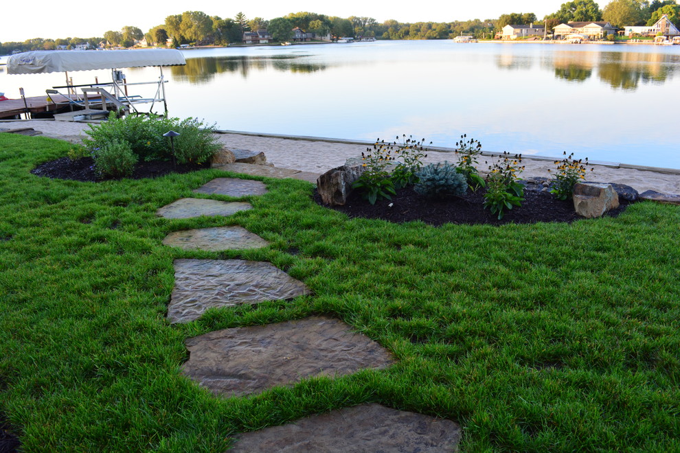 Design ideas for a rustic backyard stone garden path in Omaha.