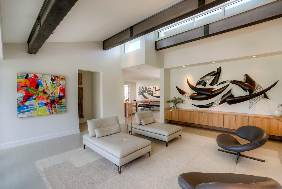 Photo of a contemporary open concept living room in Phoenix with white walls, porcelain floors, no fireplace and a wall-mounted tv.