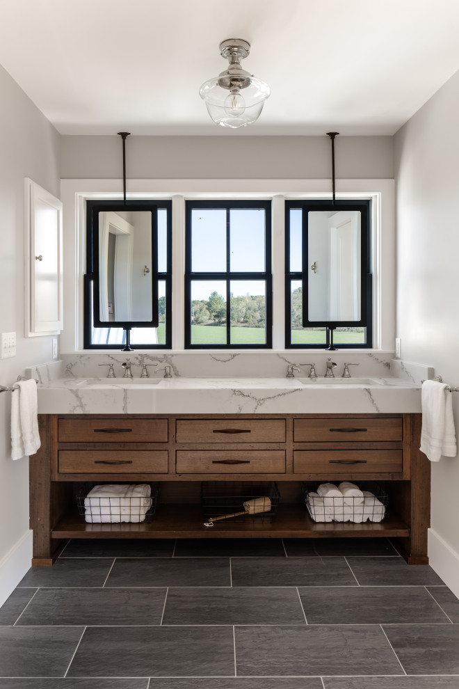 Photo of a mid-sized country master bathroom in Columbus with flat-panel cabinets, medium wood cabinets, beige walls, ceramic floors, an undermount sink, engineered quartz benchtops, grey floor, white benchtops, a double vanity and a built-in vanity.