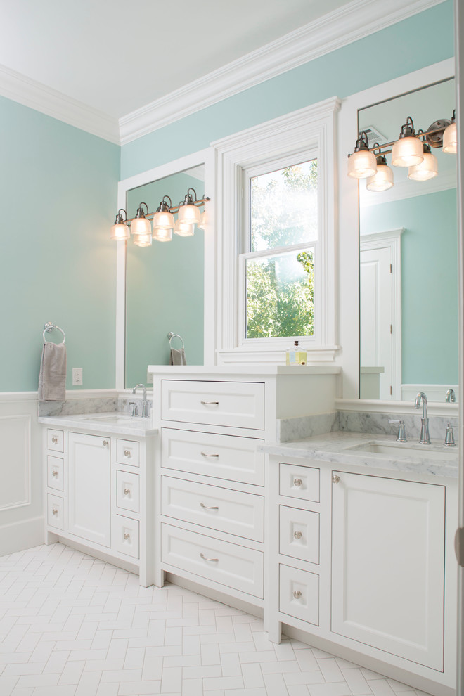 Inspiration for an expansive traditional master bathroom in Houston with recessed-panel cabinets, white cabinets, white tile, blue walls, an undermount sink, a claw-foot tub, marble benchtops, a hinged shower door, a double vanity and a built-in vanity.