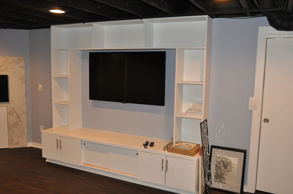 Modern home theatre in Cleveland with a built-in media wall.