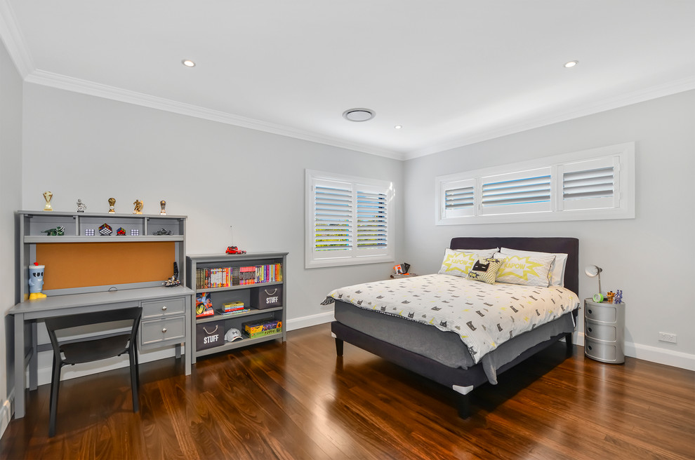 This is an example of a large contemporary gender-neutral kids' room in Sydney with grey walls, medium hardwood floors and brown floor.