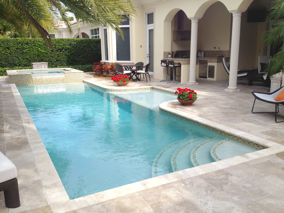 Photo of a large contemporary backyard rectangular lap pool in Miami.