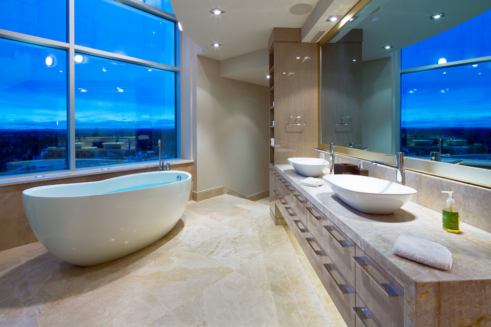 Large contemporary master bathroom in Calgary with flat-panel cabinets, dark wood cabinets, a freestanding tub, a corner shower, multi-coloured tile, white walls, travertine floors, a vessel sink, beige floor, a hinged shower door and grey benchtops.