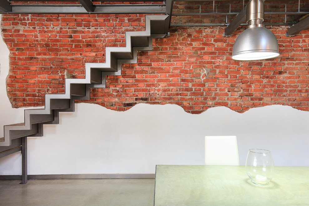 Design ideas for a mid-sized industrial straight staircase in Milan.