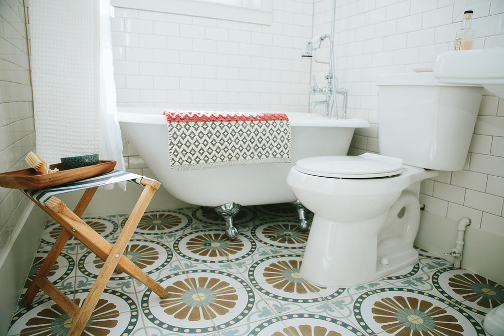Inspiration for a small eclectic bathroom in Denver with a claw-foot tub, a shower/bathtub combo, white tile, subway tile, cement tiles, a pedestal sink, multi-coloured floor and a shower curtain.