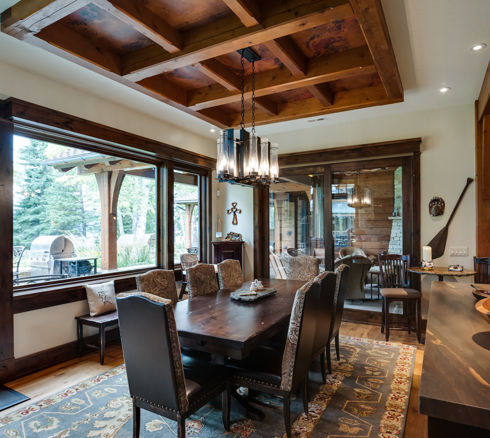 This is an example of a mid-sized country separate dining room in Other with beige walls, light hardwood floors, no fireplace and brown floor.
