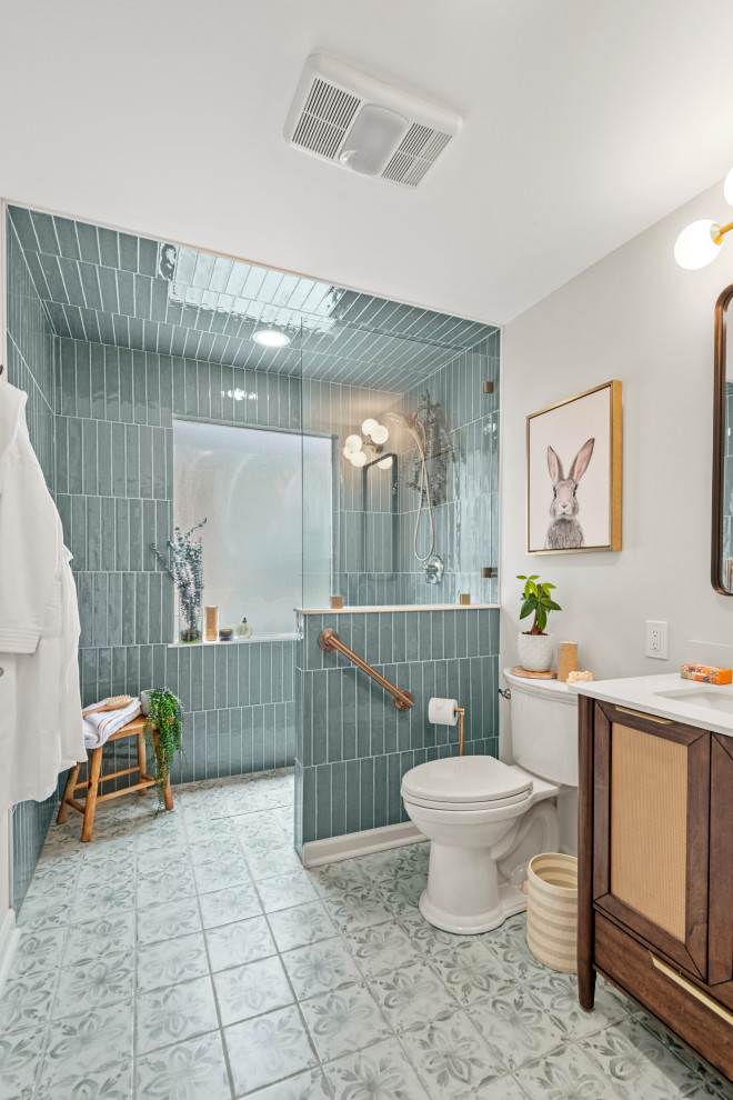 Example of a small master blue tile and ceramic tile single-sink bathroom design in New Orleans with recessed-panel cabinets, brown cabinets, an undermount sink, quartzite countertops, white countertops and a freestanding vanity