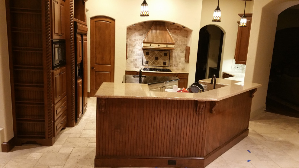 Inspiration for a transitional dark wood floor open concept kitchen remodel with a farmhouse sink, blue backsplash, glass tile backsplash and white countertops