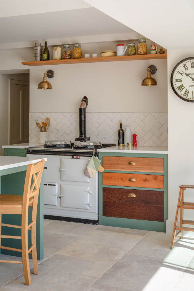 Design ideas for a large farmhouse galley open plan kitchen in Other with a double-bowl sink, shaker cabinets, green cabinets, an island, grey floors and white worktops.