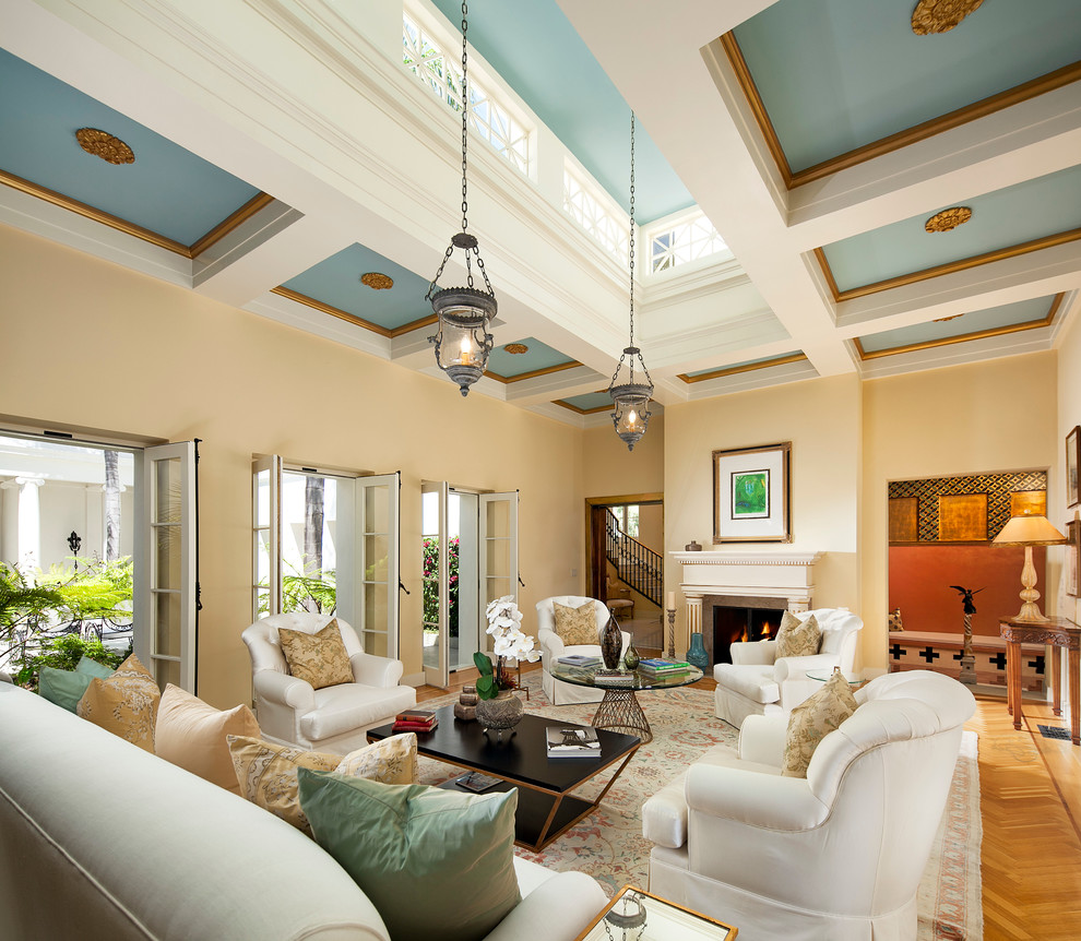Photo of a mid-sized traditional open concept living room in Santa Barbara with beige walls and light hardwood floors.