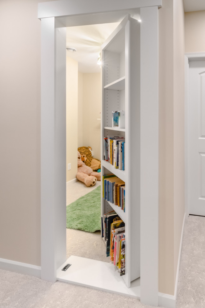 Small transitional underground carpeted and beige floor basement game room photo in Minneapolis with beige walls